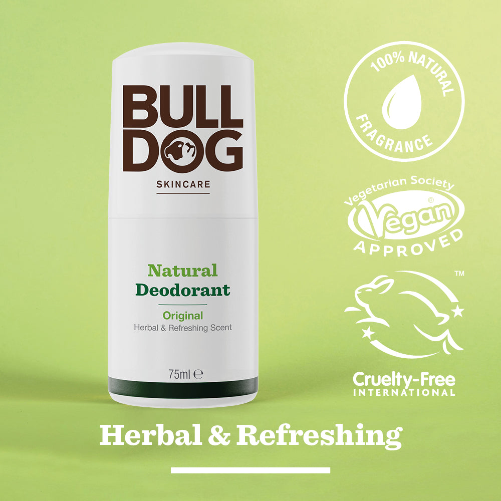 Bulldog Skincare Original Natural Deodorant stick (75ml) for men shown on a green background with 100% natural fragrance, vegan approved, and cruelty-free logos. Text: Herbal & Refreshing, 24-hour odour protection.