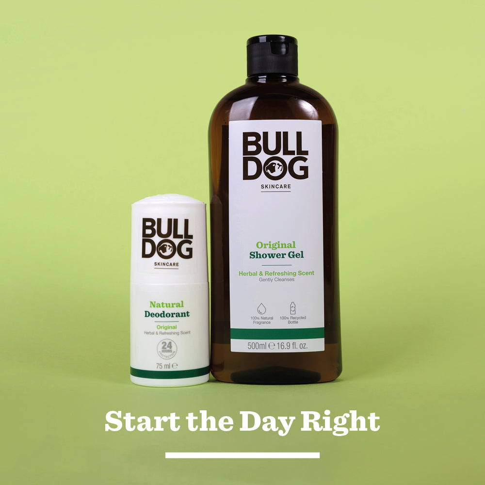 Bulldog Skincare Original Natural Deodorant and Original Shower Gel stand on a light green surface against a matching background. Text below reads, Start the Day Right.