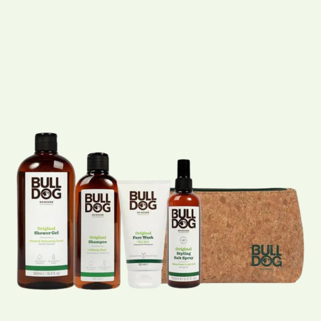 The Hair Styling Salt Spray Bundle for men’s grooming includes shower gel, shampoo, face wash, Hair Styling Salt Spray, and a brown Bulldog toiletry bag with logo, all showcased against a light background.